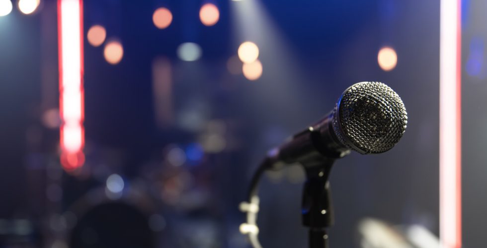 close-up-of-a-microphone-on-a-concert-stage-with-beautiful-lighting_Easy-Resize.com