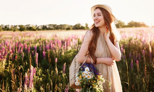 happy-young-girl-walking-in-flower-field-at-sunset-wearing-straw-hat-and-bag-full-of-flowers_Easy-Resize.com (1)