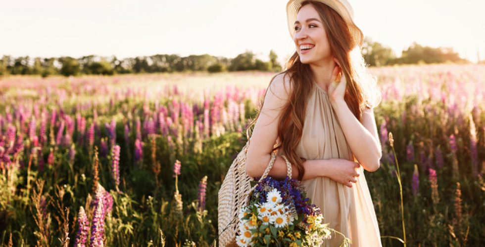 happy-young-girl-walking-in-flower-field-at-sunset-wearing-straw-hat-and-bag-full-of-flowers_Easy-Resize.com (1)